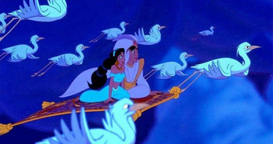 Aladdin and Jasmine soar above the clouds on Magic Carpet