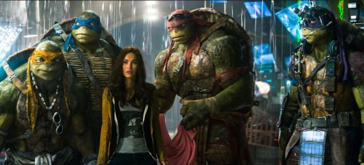 Left to right: Michelangelo, Leonardo, Megan Fox as April O'Neil, Raphael, and Donatello in TEENAGE MUTANT NINJA TURTLES, from Paramount Pictures and Nickelodeon Movies.